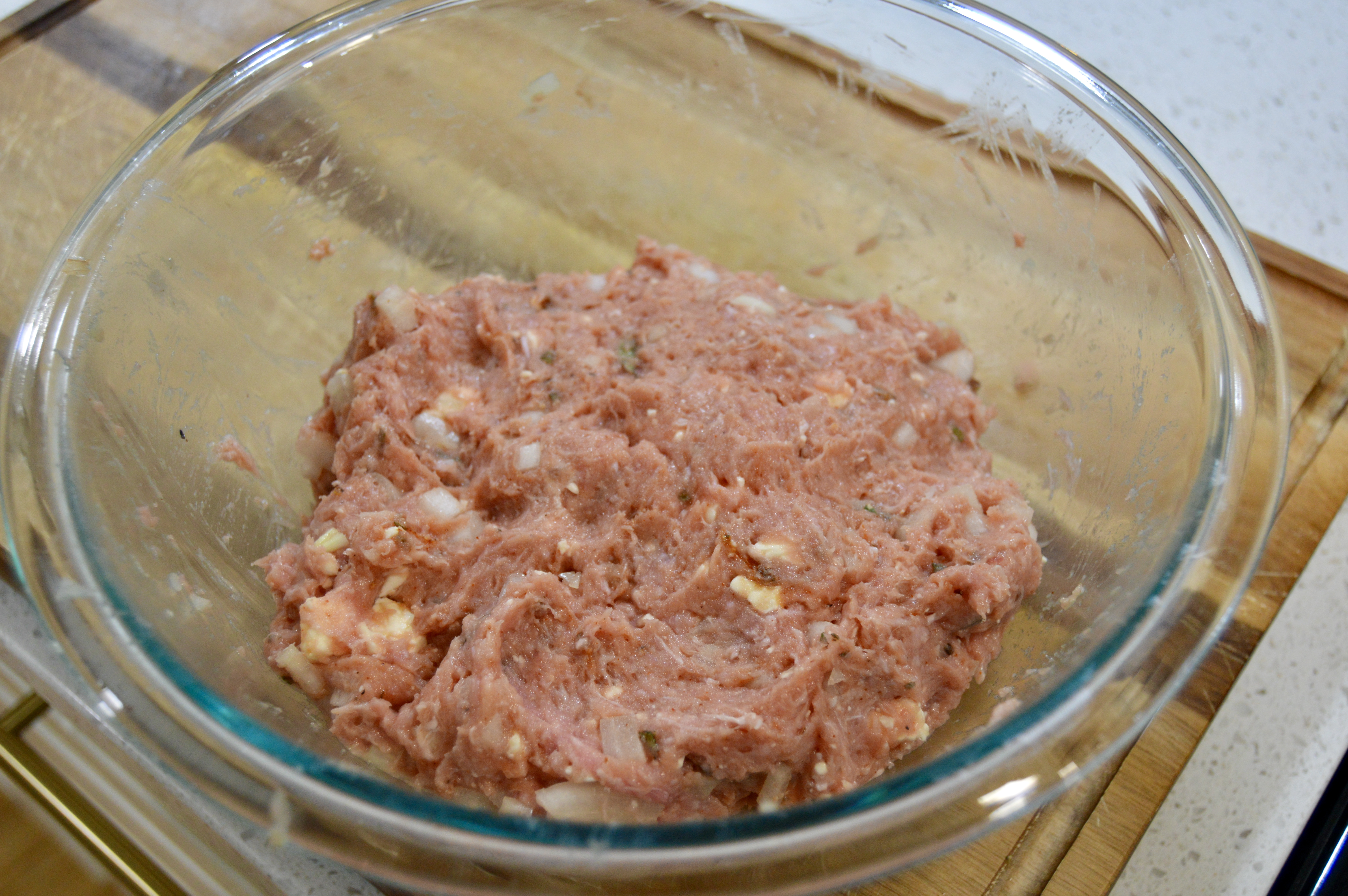 Ground turkey mixture for turkey and sage meatballs.