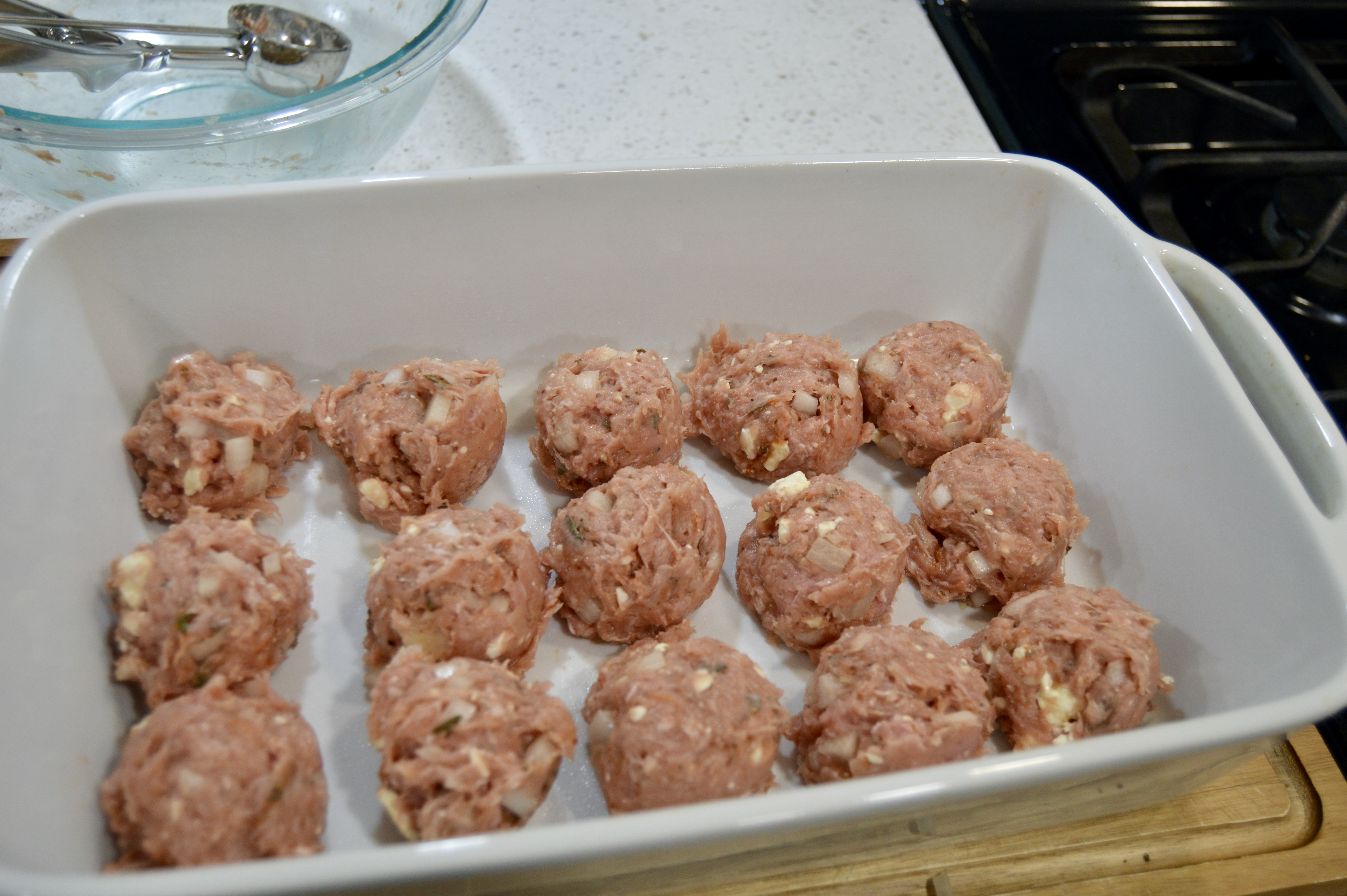 Formed turkey and sage meatballs in 9x11 baking dish prior to baking.