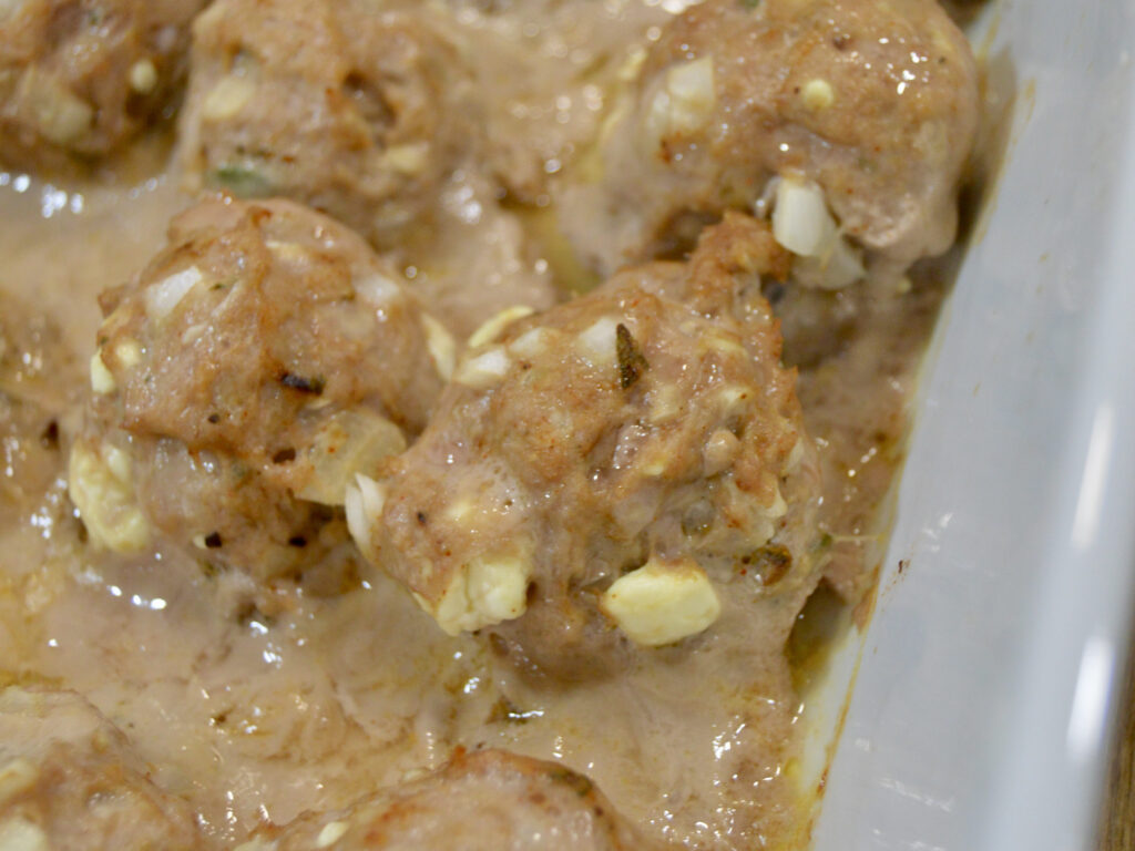 Golden brown turkey and sage meatballs after baking.