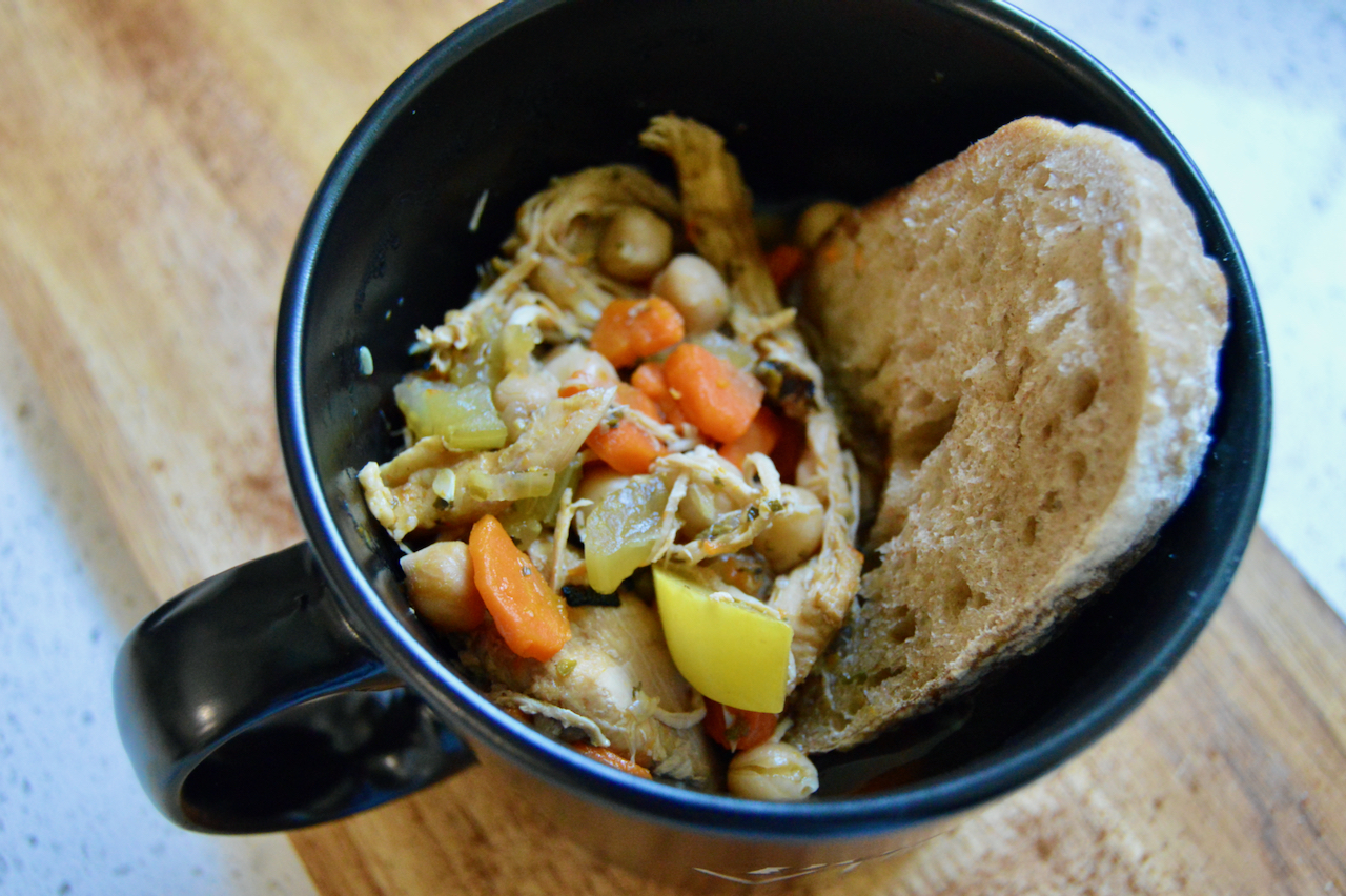 Nourishing lemon chicken soup with hearty sourdough bread for a soul-warming meal.