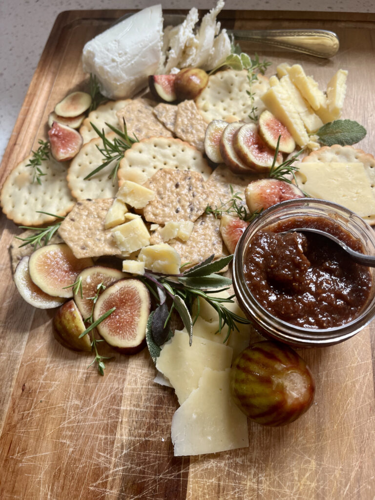 Spiced fig butter displayed on an artisan charcuterie board.