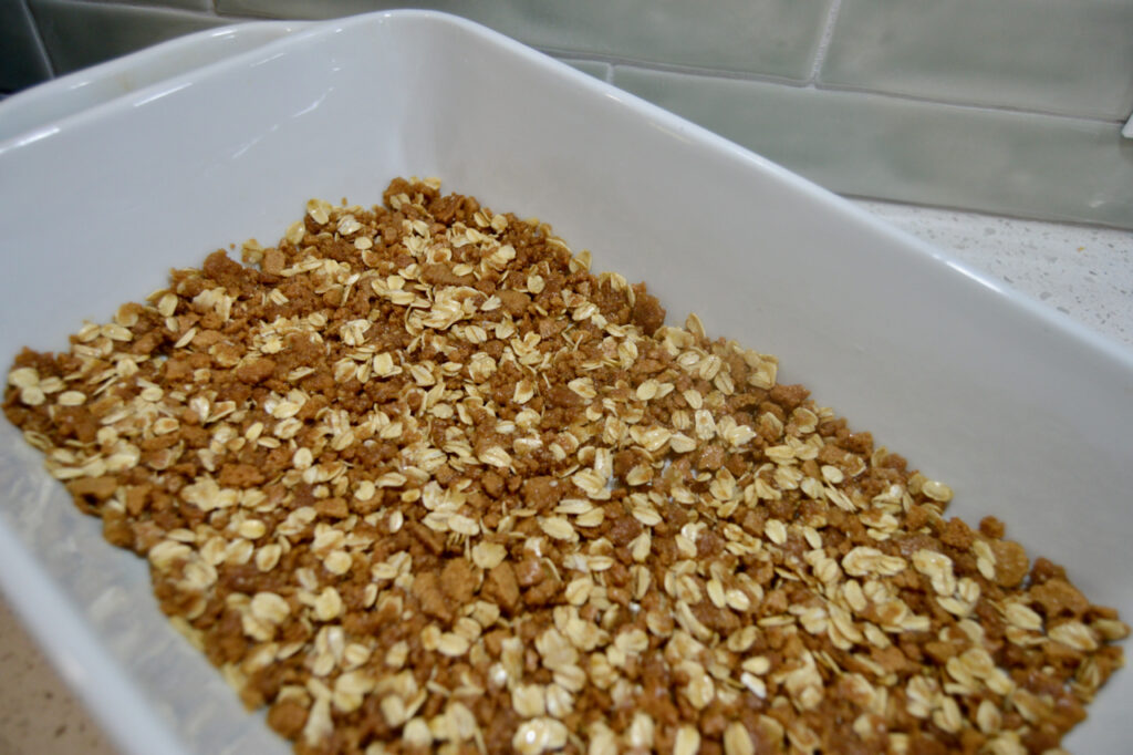 Crushed ginger spice cookies to make a flavorful, crispy crust for the pumpkin pie bars.