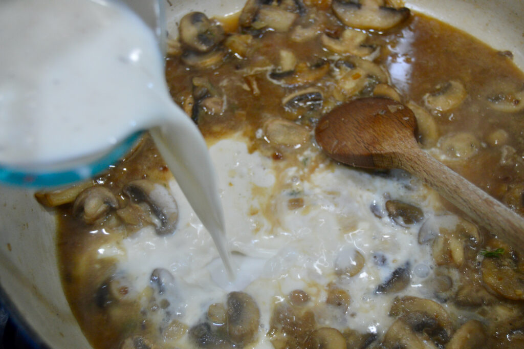 Cream of mushroom soup is made by adding milk to mushrooms and chicken broth.