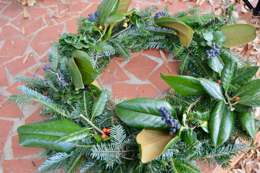 A unique and natural wreath decorated with foraged greenery.