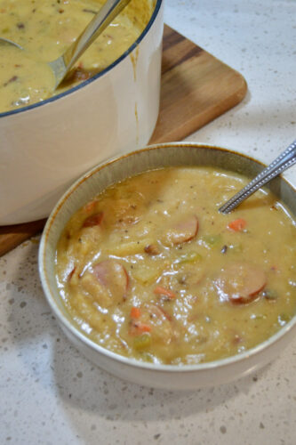 Hearty bowl of kielbasa potato soup, full of protein and vegetables.