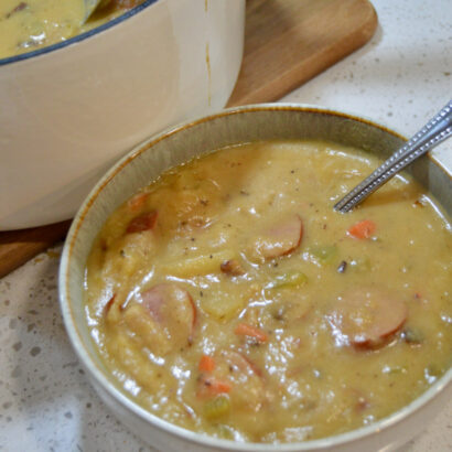 Hearty bowl of kielbasa potato soup, full of protein and vegetables.