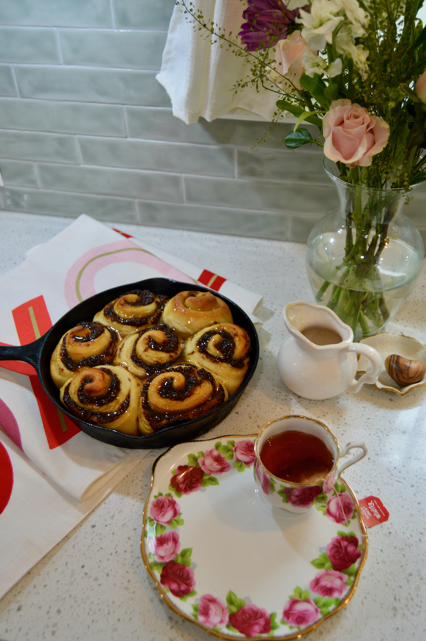 Decorative sourdough fig butter cinnamon rolls for a feminine Galentine's brunch.