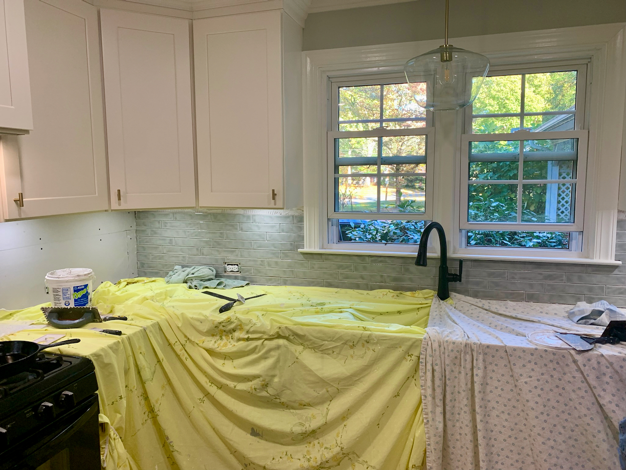 The process of putting up backsplash tile