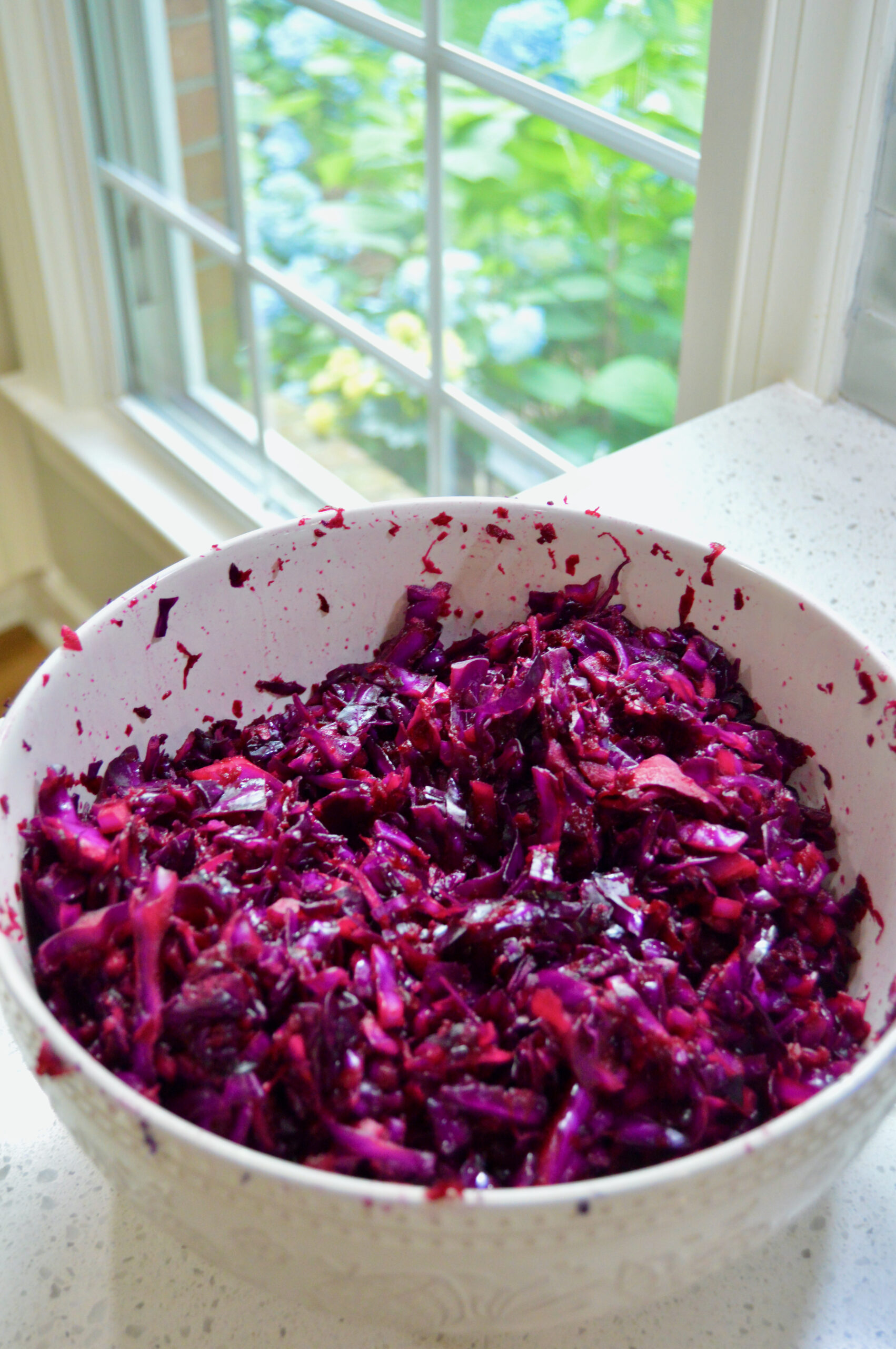 Finely chopped red cabbage, beets and ginger to make purple sauerkraut.